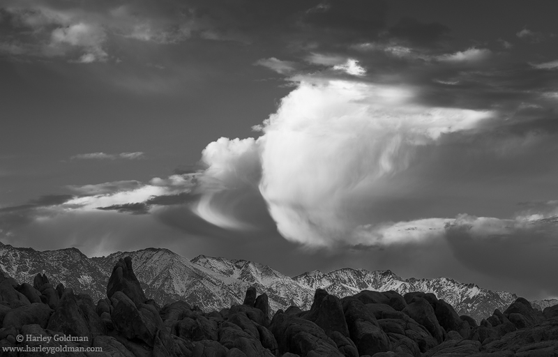 Clouds build up over the eastern Sierra and Alabama Hills formations.