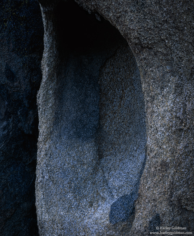 In the deep shadows beneath a blue sky, blue light reflects off Sierra granite.