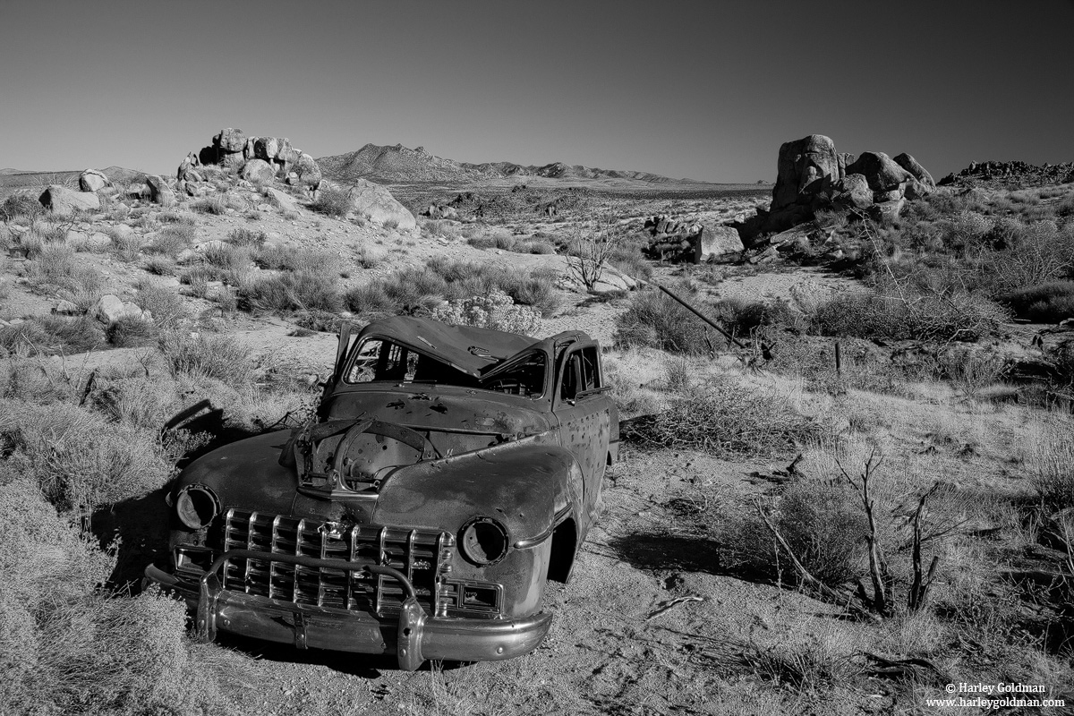 An abandoned car at an old mine in the Mojave desert